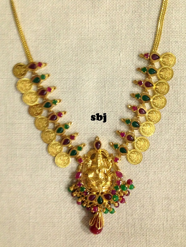 gold set with rubies and emeralds